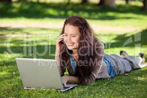 Woman phoning in the park