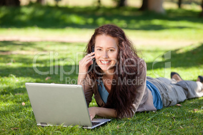 Woman phoning in the park