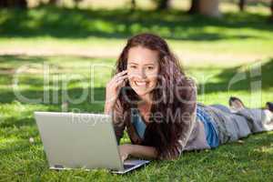 Woman phoning in the park