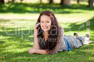 Woman phoning in the park