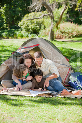 Joyful family camping