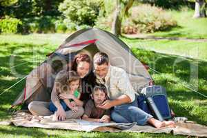 Joyful family camping