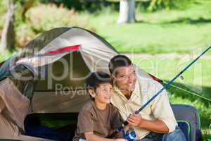 Son fishing with his father