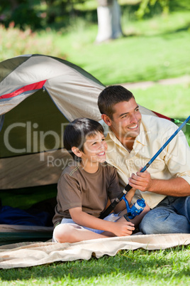 Son fishing with his father