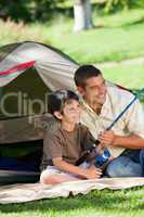 Son fishing with his father