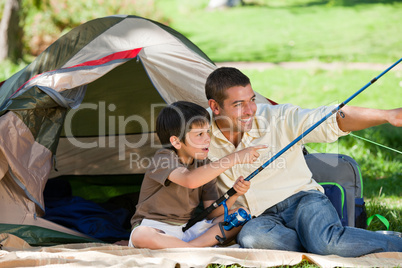 Son fishing with his father