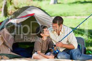 Son fishing with his father