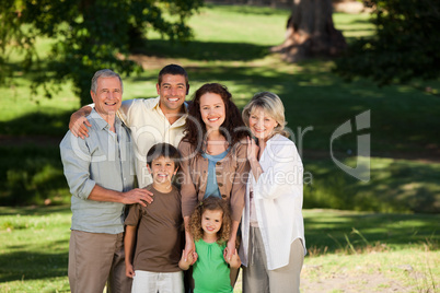 Family looking at the camera in the park Family looking at the camera in the park