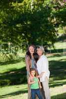 Family looking at the camera in the park