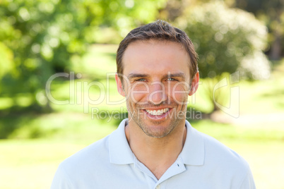 Man smiling in the park