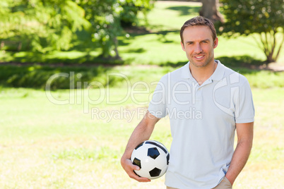 Handsome man with a ball