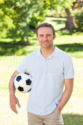 Handsome man with a ball