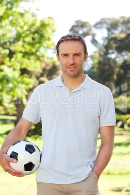 Handsome man with a ball