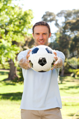 Handsome man with a ball