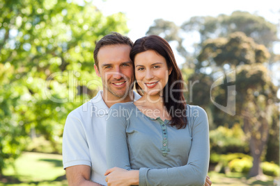 Beautiful couple hugging in the park