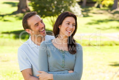 Beautiful couple hugging in the park