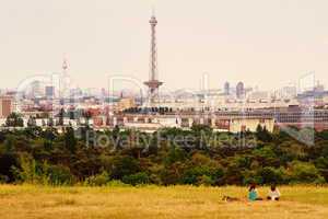 Girls relaxing in backround of berlin city skyline