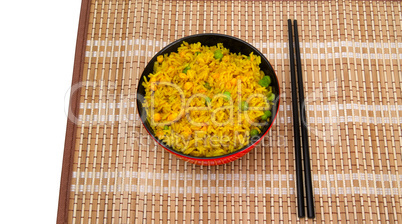 Bowl of rice and chopsticks