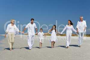 Three Generations of Family Walking Holding Hands on Beach