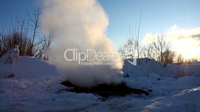 pan on steam from water system and winter sky in russia