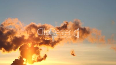 Smoke from pipe of termal power station at sunset