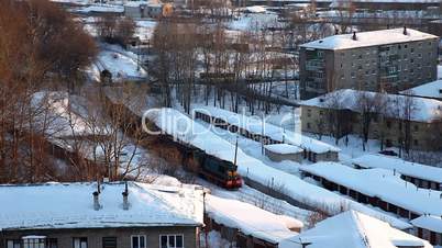 Train with cargo in winter city - Russia