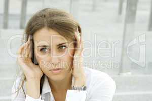 Business woman suffering from headache