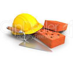 Bricks, trowel and a yellow plastic helmet