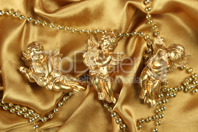 Three small gold angel