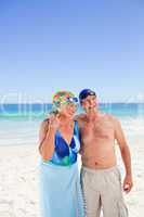 Happy elderly couple on the beach