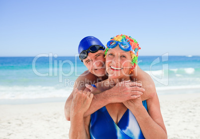 Happy elderly couple on the beach