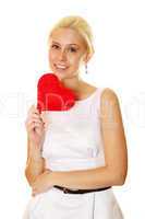 Young woman holding red heart