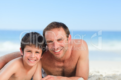 Father with his son on the beach