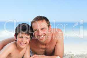 Father with his son on the beach