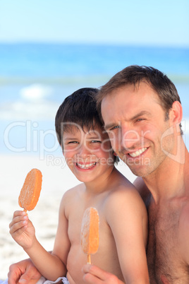 Father eating an ice cream with his son
