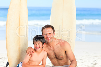 Father and son with their surfboards