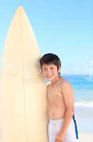 Boy with his surfboard