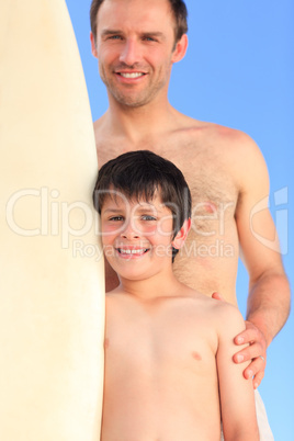 Father and son with their surfboards