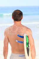 Man with his surfboard