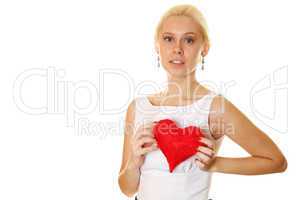 Young woman holding red heart