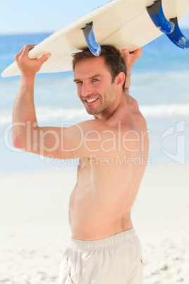 Handsome man with his surfboard Handsome man with his surfboard