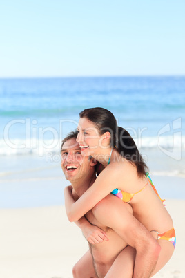 Man with his wife on the beach