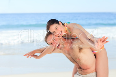 Woman with her husband on the beach