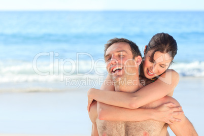 Woman with her husband on the beach