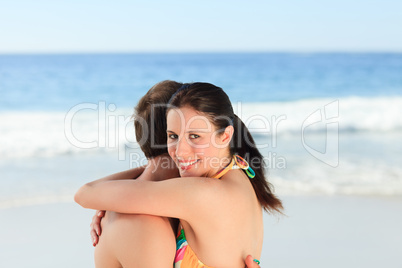 Lovely couple hugging on the beach