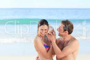 Couple listening to their shell