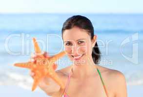 Pretty woman with a starfish