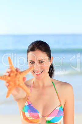 Pretty woman with a starfish