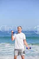 Man doing his exercises on the beach