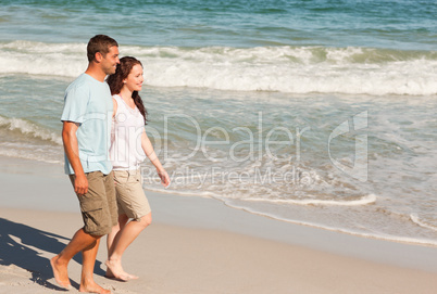 Couple walking on the beach Couple walking on the beach
